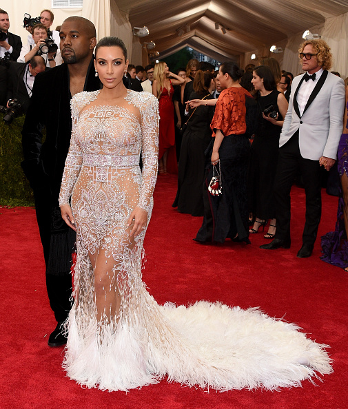 Kim Kardashian walked the red carpet in a sheer see-through embroidered gown from Roberto Cavalli by Peter Dundas.